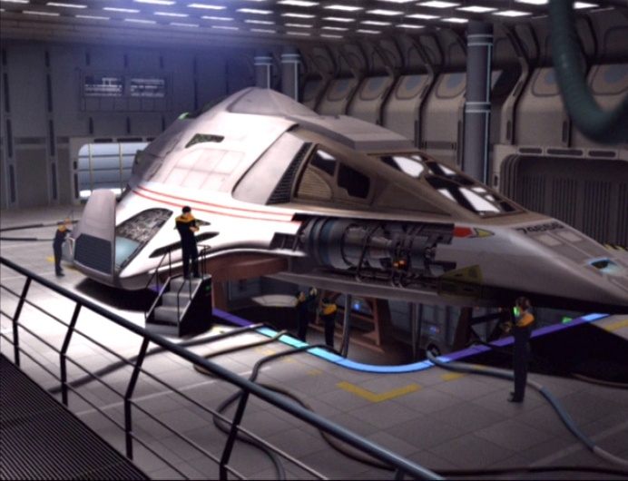 The Delta Flyer is built in the shuttle bay.